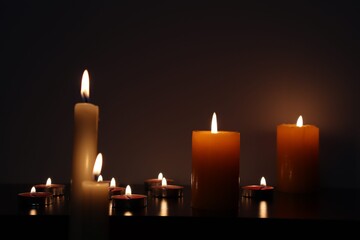 Candle black background of mourning funeral moment of silence	