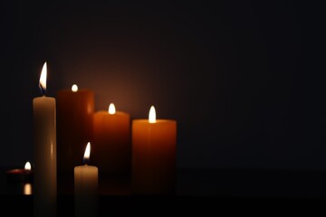 Candle black background of mourning funeral moment of silence	