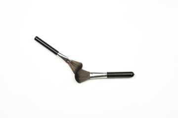 Pair of makeup brushes on the white background