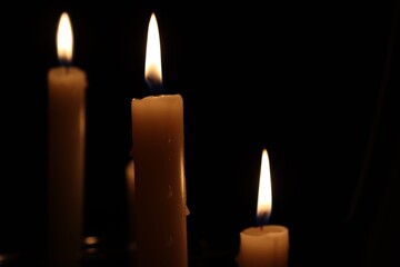 Candle black background of mourning funeral moment of silence	