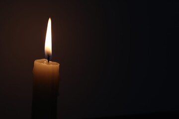 Candle black background of mourning funeral moment of silence	