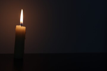 Candle black background of mourning funeral moment of silence	