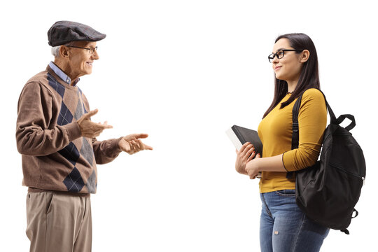 Elderly Man Talking To A Female Student With A Backpack And Books