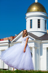 Young beautiful girl in ballroom prom dress