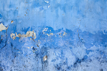 Old grungy brick wall texture in navy blue tone.