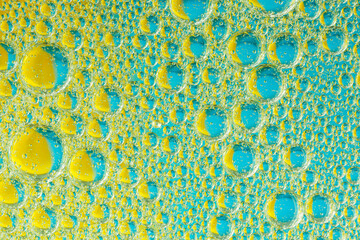 Bubbles on blue and yellow background 2. Macro