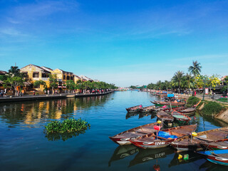 Fototapeta na wymiar Thu Bon river and boats in Hoi An ancient town, Vietnam