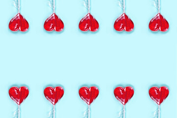 Red heart lollipop background. Copy space. Festive concept