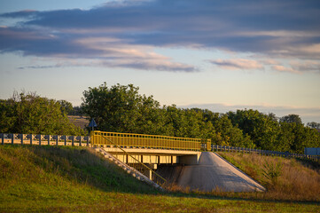 Road bridge in sunset rays