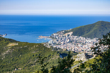 Fototapeta na wymiar A view from the height of the mountainous area, the city and the sea bay. Adriatic coast. Montenegro