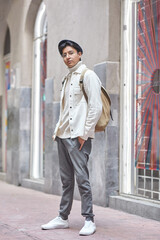young man wearing white clothes in the city