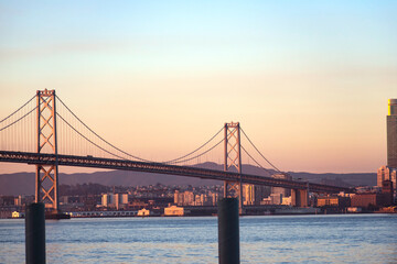 Fototapeta na wymiar View of the sea and the Bay Bridge at sunrise