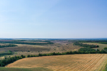Fototapeta na wymiar Aerial photography of agricultural fields in Russia. Beautiful views. Sunny day.