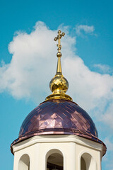 An Orthodox church shot on a clear autumn day against the backdrop of a bright blue sky.
