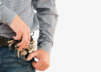 A large bunch of keys does not fit into a jeans pocket for a man