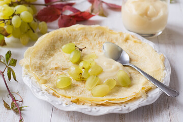 Crepes with grapes and pastry cream