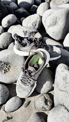 running shoes left on rocks