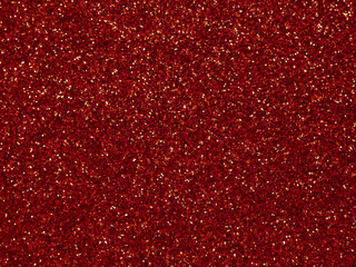 A glittery red paper. Golden glitter light bokeh abstract texture. Pattern designs. Sparkle wallpaper for Christmas. Brilliance shimmering sequin background. Party time.