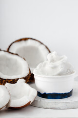 Fototapeta na wymiar Coconut ice cream in cup on white background
