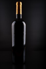 Fototapeta na wymiar wine bottle with black background