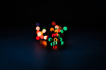 Festive Christmas lights, blurred background for the new year and your holiday. Celebrating the new year or birthday