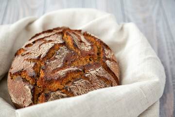close-up freshly baked hot rye circle bread