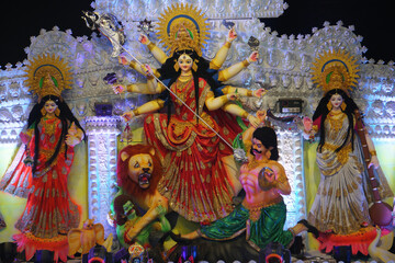 Picture of the great fort festival of Hinduism. The image of the Durga Devi's Family. It is a sculpture made by the artist with clay and straw.