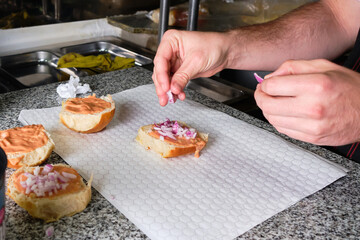Man cooking hamburger in quarantine pandemic times