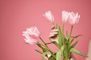 Fototapeta premium Bouquet of flowers as a gift holiday on March 8 pink background