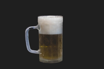 a full beer mug with black background