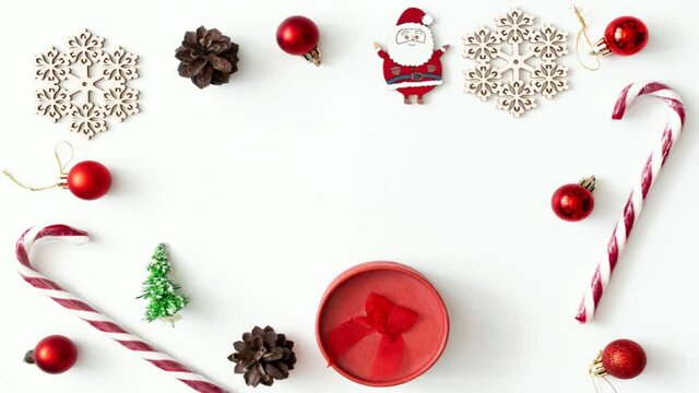 Stop motion animation. Christmas decoration in red color frame flat lay, new year concept video with copy space