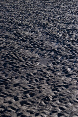 Textures made by water and wind on the sand at the beach