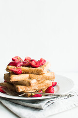 French toast with strawberries and maple syrup