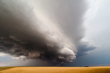 Deurstickers Storm clouds over a wheat field © JSirlin