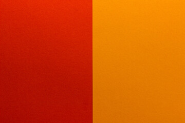 Background of two vertical rectangles red and orange. Sheets of blank red and orange paper with fine texture, split vertically, close up.