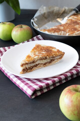 Homemade apple pies on dark background. Autumn dessert.