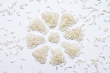 Rice grits on a white background. Rice grits laid out in a circle.