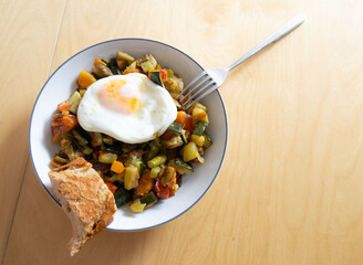 Transparent bowl full of healthy and fresh vegetables with egg, Spanish ratatouille
