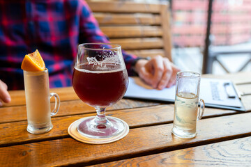 The concept of alcoholism, the fight against alcohol addiction, depression. A man drinking alcohol alone in a bar.