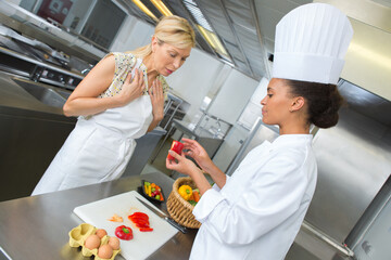 trainee chef asking question about red pepper