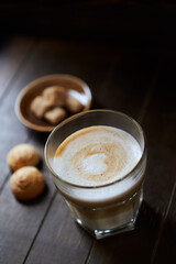 Coffee with milk on dark wooden background. Close up.	