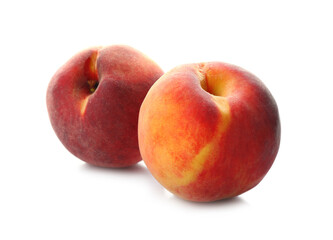 Fototapeta na wymiar Delicious ripe juicy peaches isolated on white