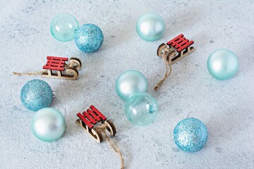 Decorative wooden sled with the inscription Merry Christmas and blue balls for decorating the Christmas tree, Christmas decor, toys.