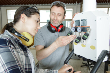 student learns how to repair an industrial power distribution center