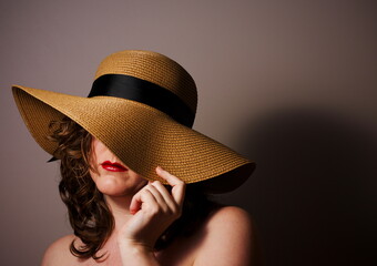 Portrait of a woman in a straw hat