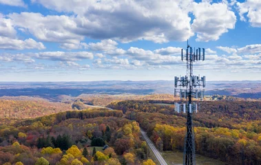 Gordijnen Aerial view of mobiel phone cell tower over forested rural area of West Virginia to illustrate lack of broadband internet service © steheap