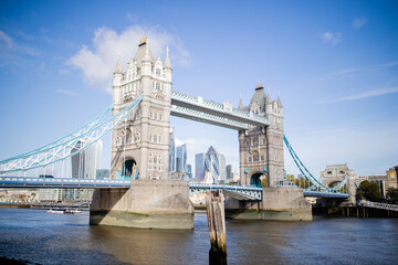 Fototapeta na wymiar Landscape View of Tower Bridge with a Cityscape and Blue Sky as Background