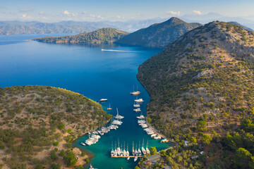 Obraz premium view to marine in bay between mountains in the morning with copy space