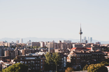 View of the evening city from the high point of the park  Cerro del Tio Pio. Madrid, Spain. Beautiful evening city scenery. 
