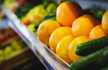 Bright orange ripe oranges on the counter in the supermarket.